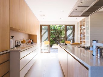 Galley kitchen with beautiful tile flooring